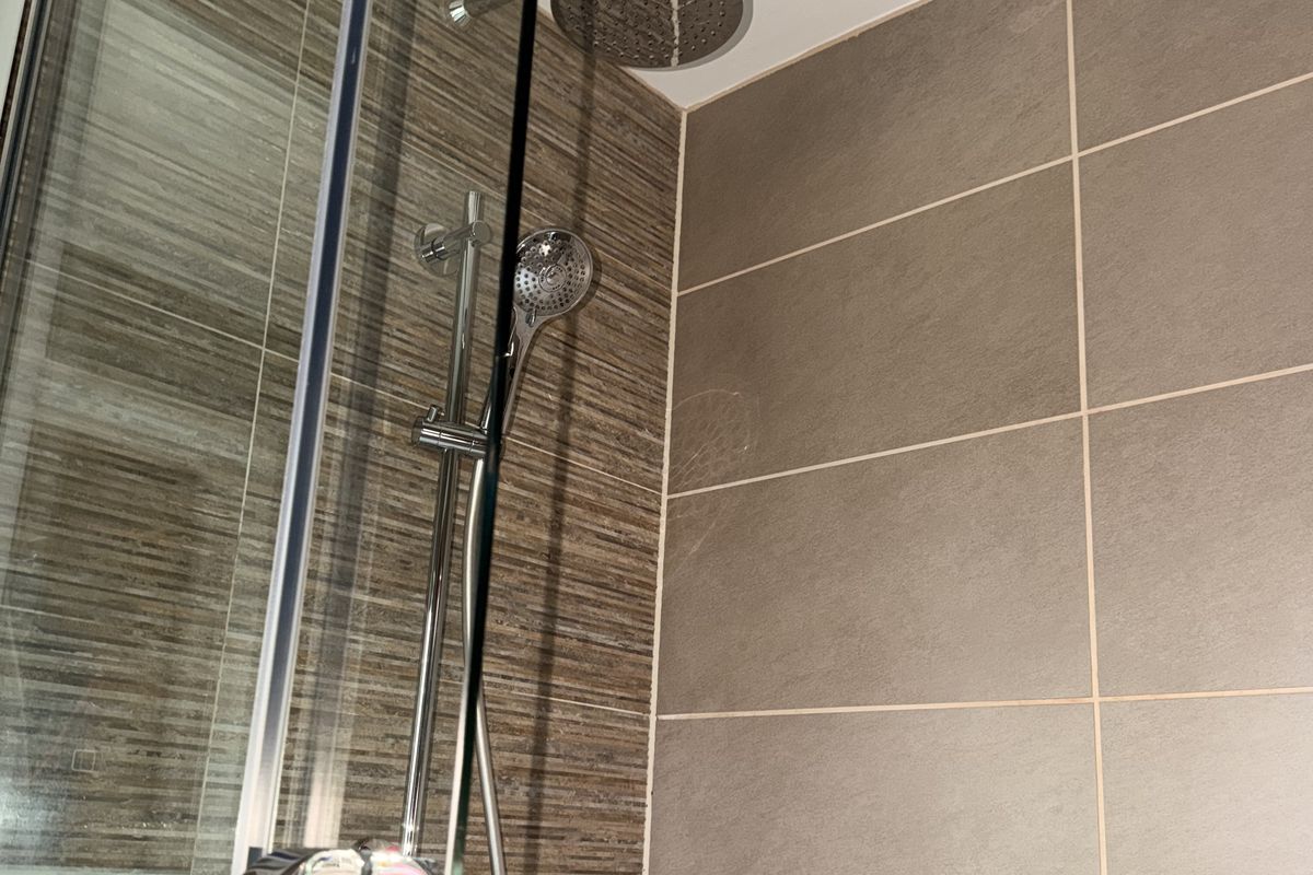 Spotless tiled shower enclosure after a deep clean in Gloucester
