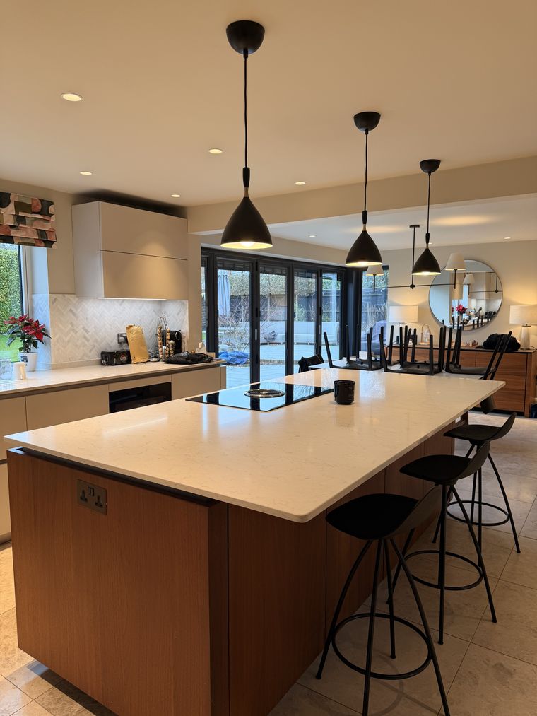 Clean kitchen with polished worktops and island in a Gloucester home