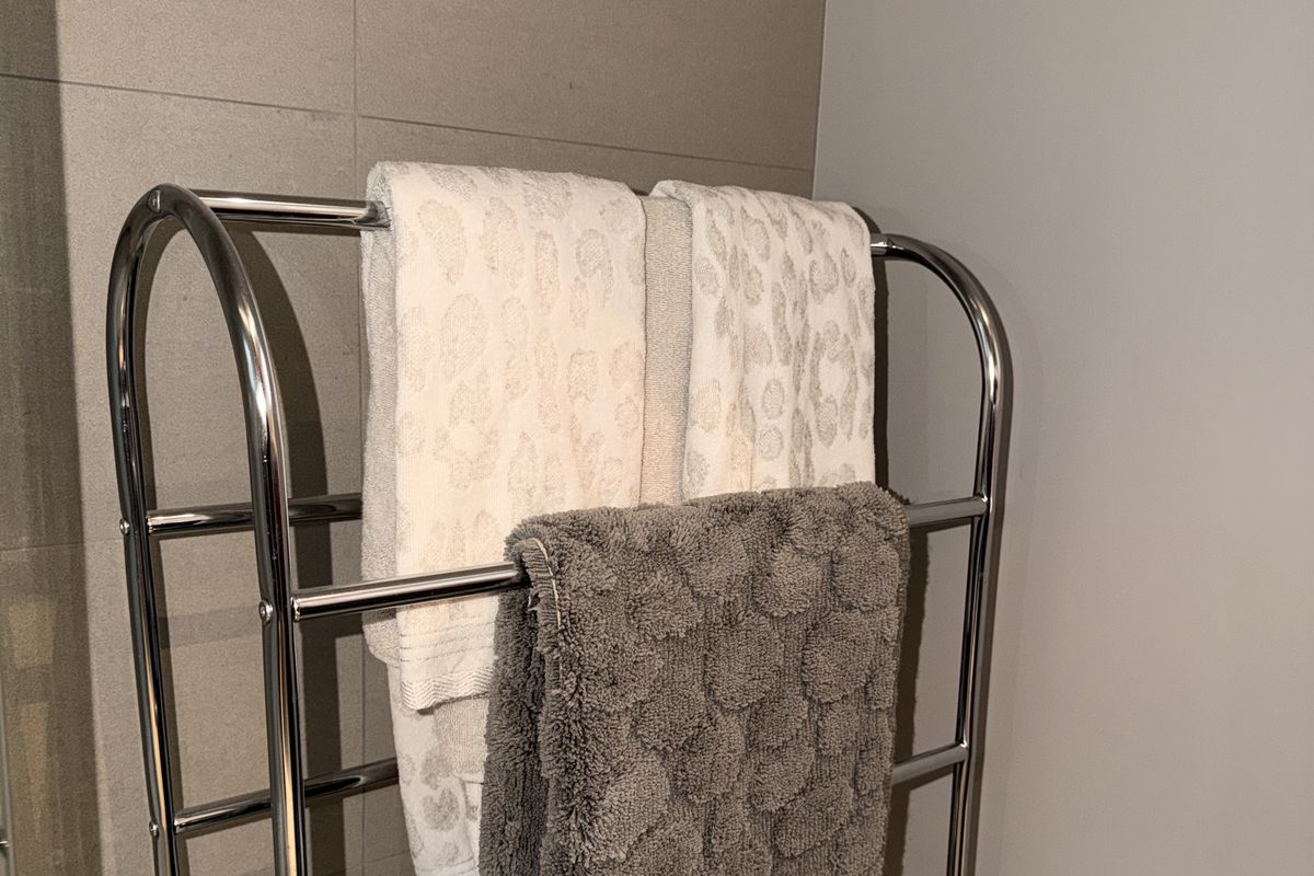 Freshly cleaned bathroom with neatly folded towels on a heated rail, Gloucester